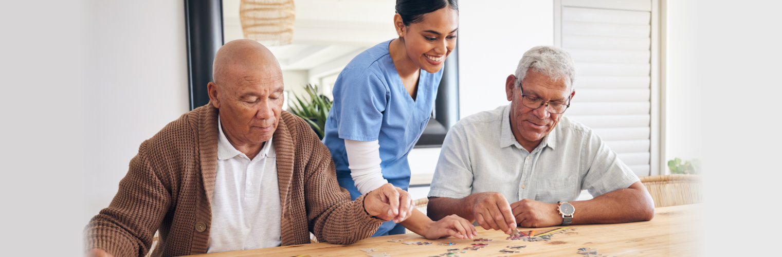 caregiver and senior men playing for entertainment