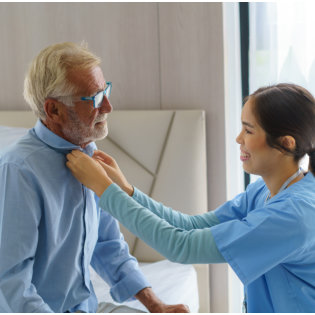 caregiver fixing patients collar